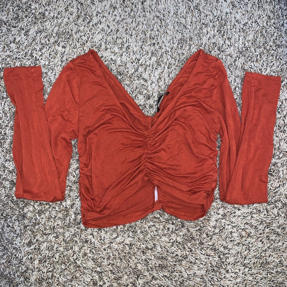 cinched burnt orange crop top